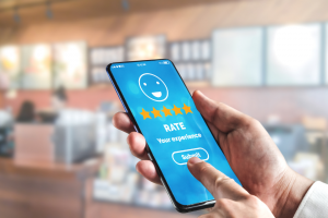 A pair of hands giving a rating on a phone